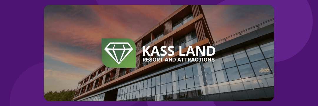 KASS LAND Resort logo over a modern building facade at sunset